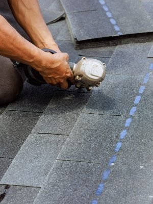 New,Asphalt,Bitumen,Shingles,Are,Being,Installed,By,Roofer,Using